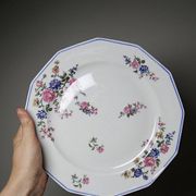 4 flat plates by Bernardaud, Limoges porcelain, floral decoration from the 1920s to 1950s.