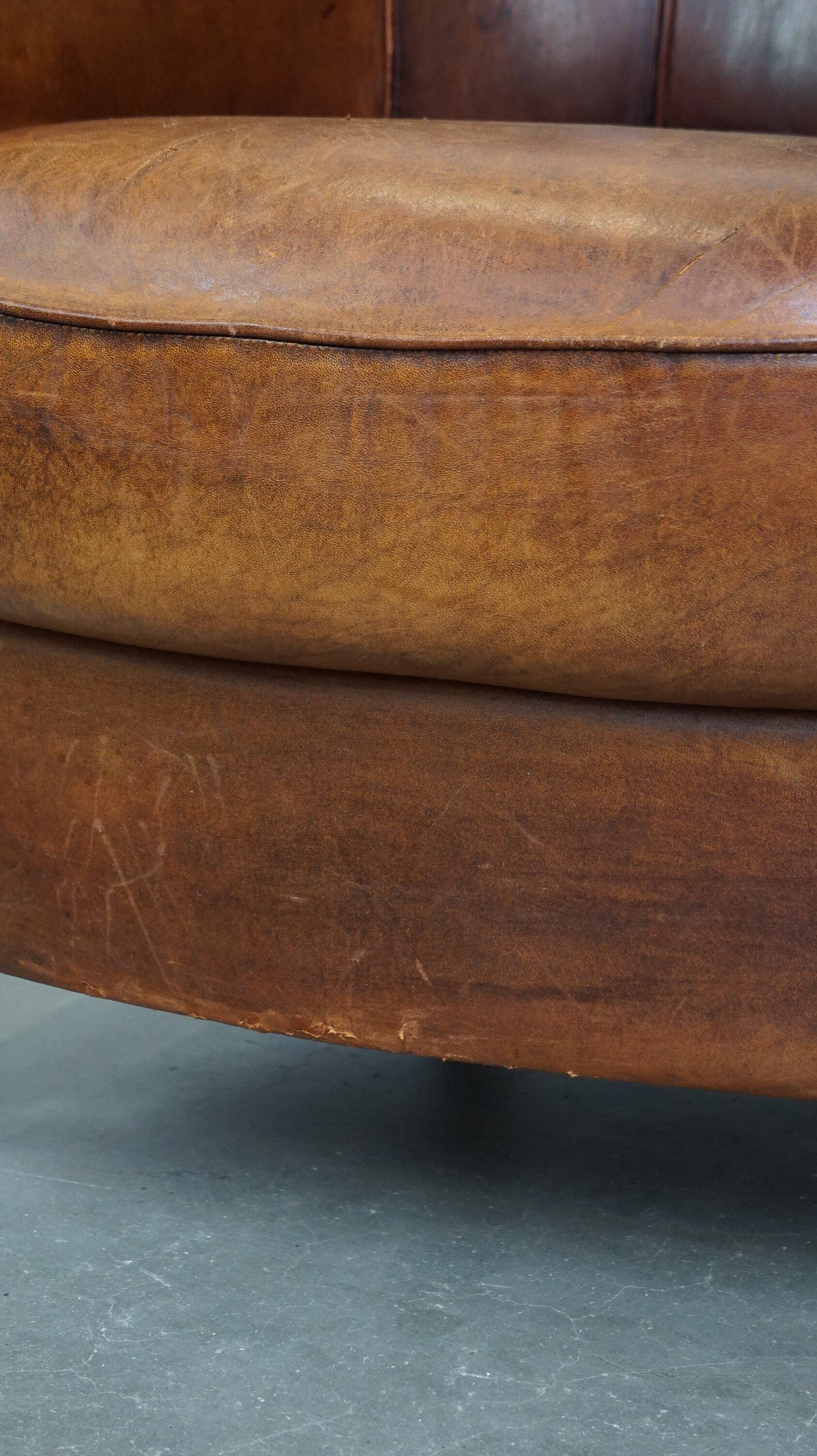 Brown leather club chair