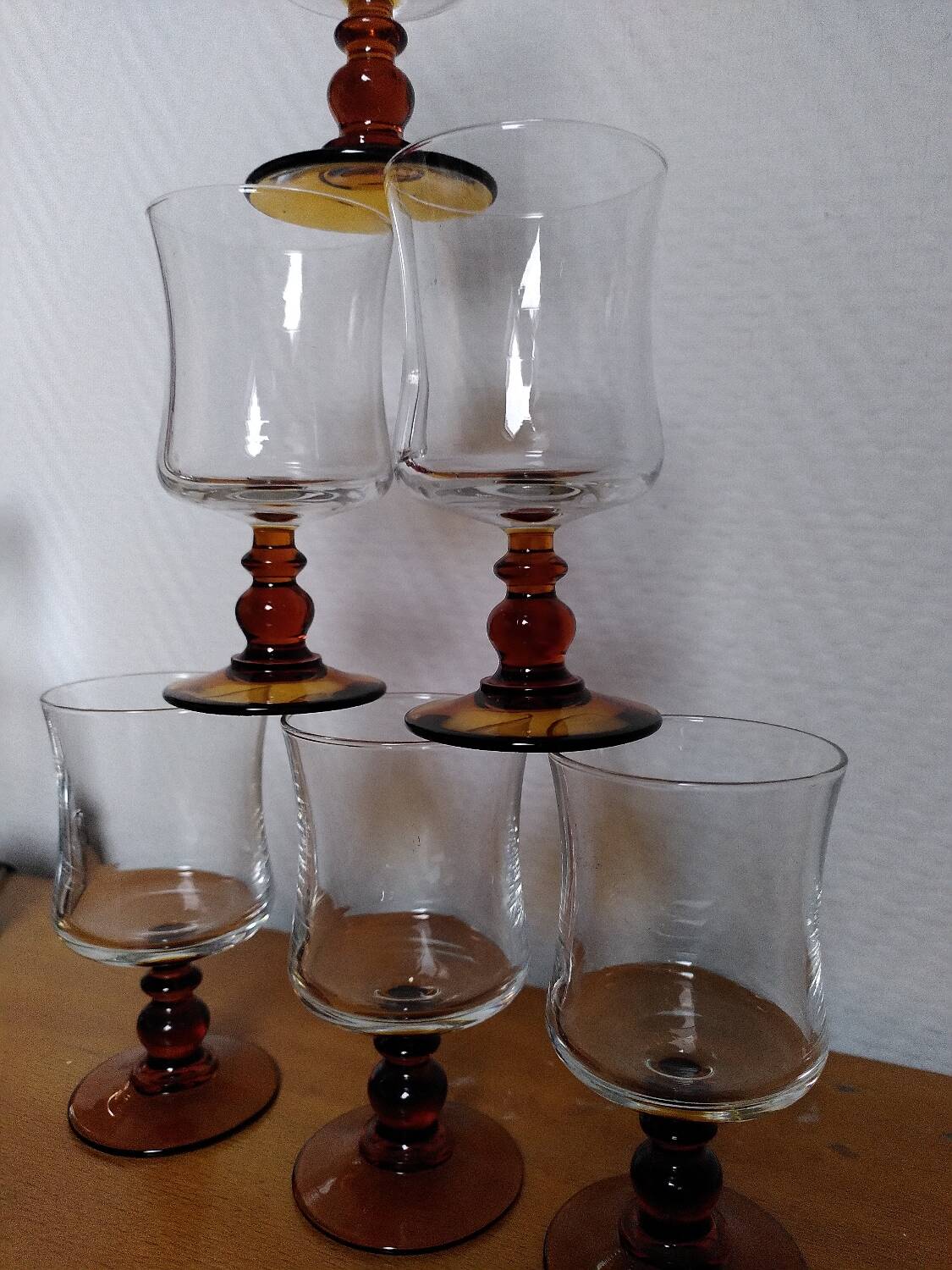 6 amber stemmed glasses