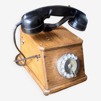 Old wooden dial crank telephone