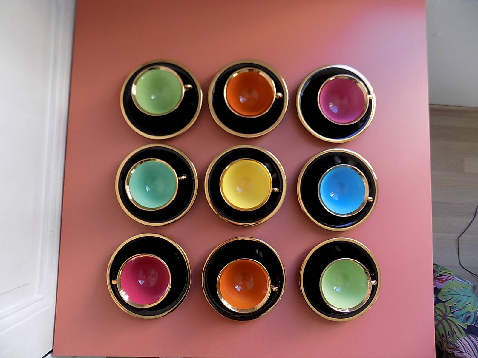 set of 9 black and gold Salins cups and saucers