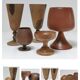 Five vintage turned wooden walking glasses