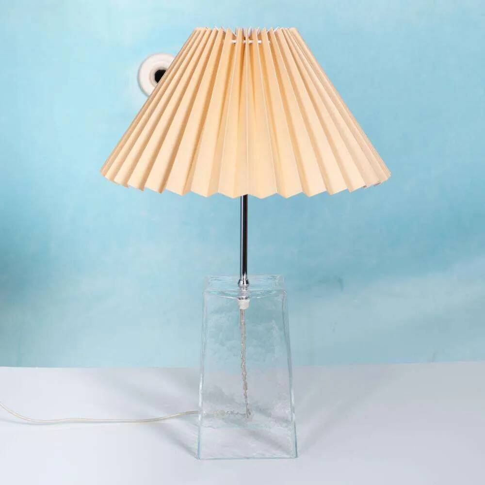 Minimalist glass table lamp from the 80s with a pleated shade.