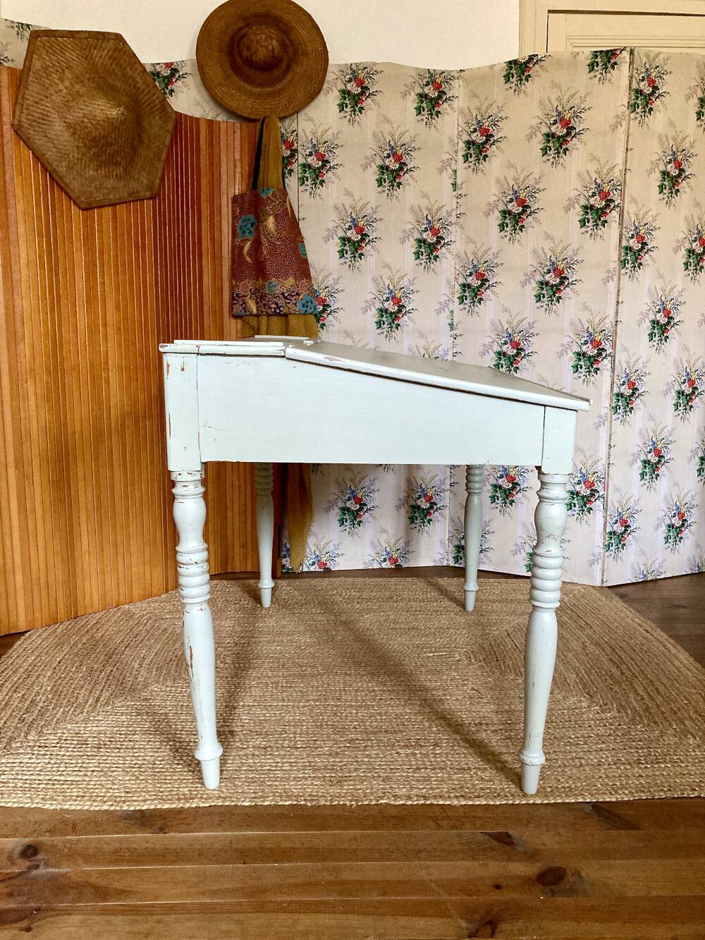 Antique wooden sloped desk, with a drop-down front and turned legs.