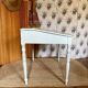 Antique wooden sloped desk, with a drop-down front and turned legs.