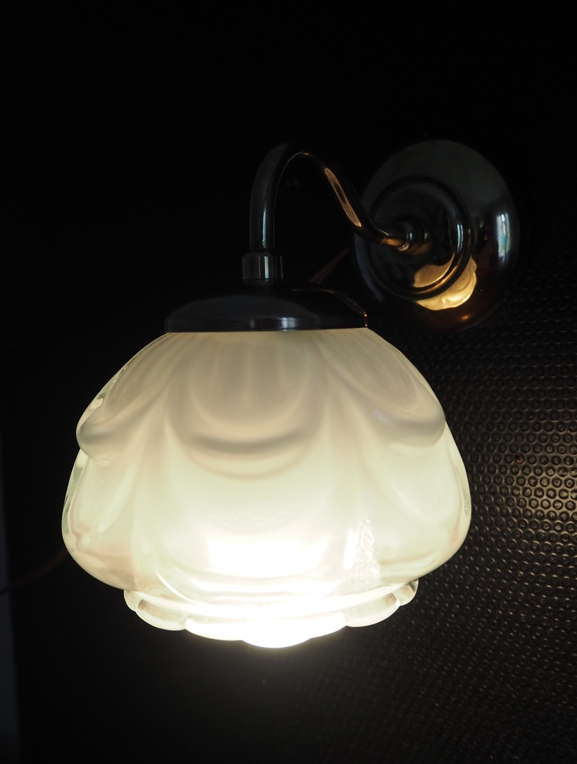 Brass wall lamp and white glass globe from the 1950s-1960s.