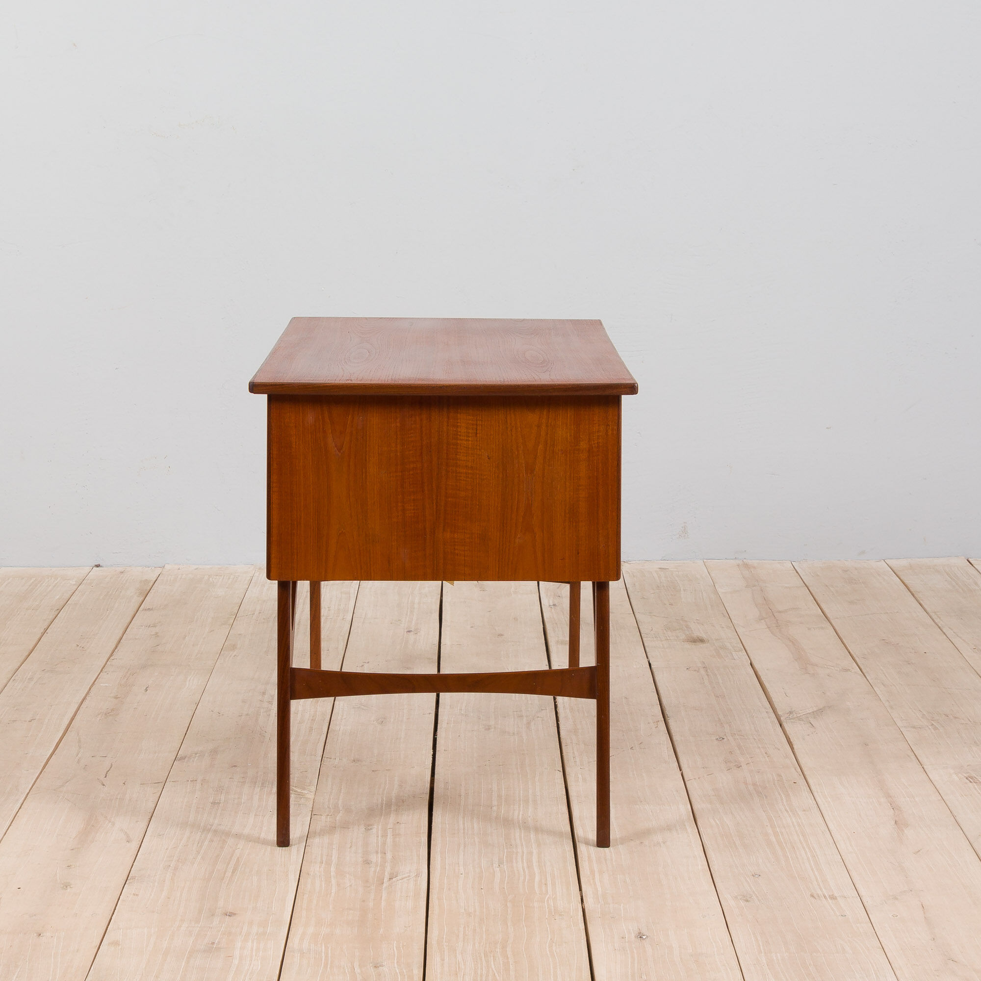 Danish mid century teak desk on sculptural base, 1960s.