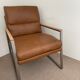 A pair genuine leather armchairs.