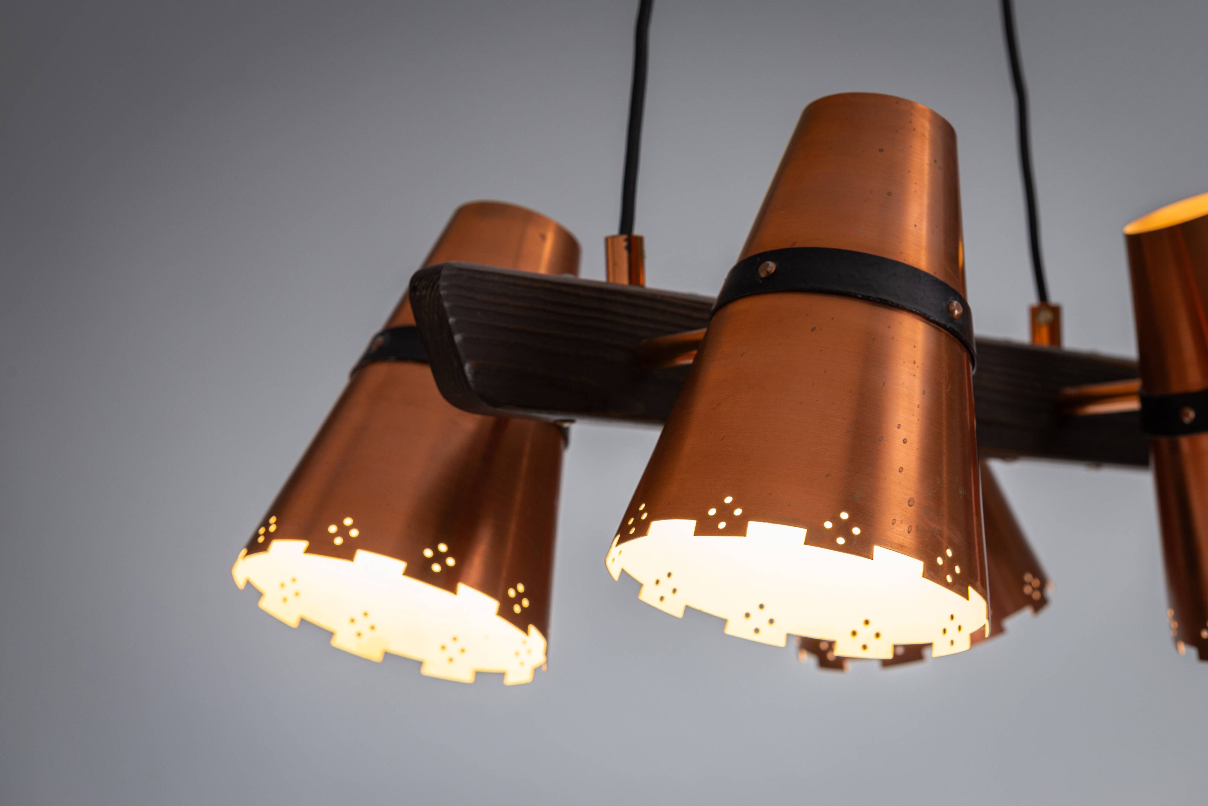 Ceiling lamp in dark stained wood with four brass shades, Sweden, 1960s
