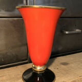Cut vase on foot in red and black metal