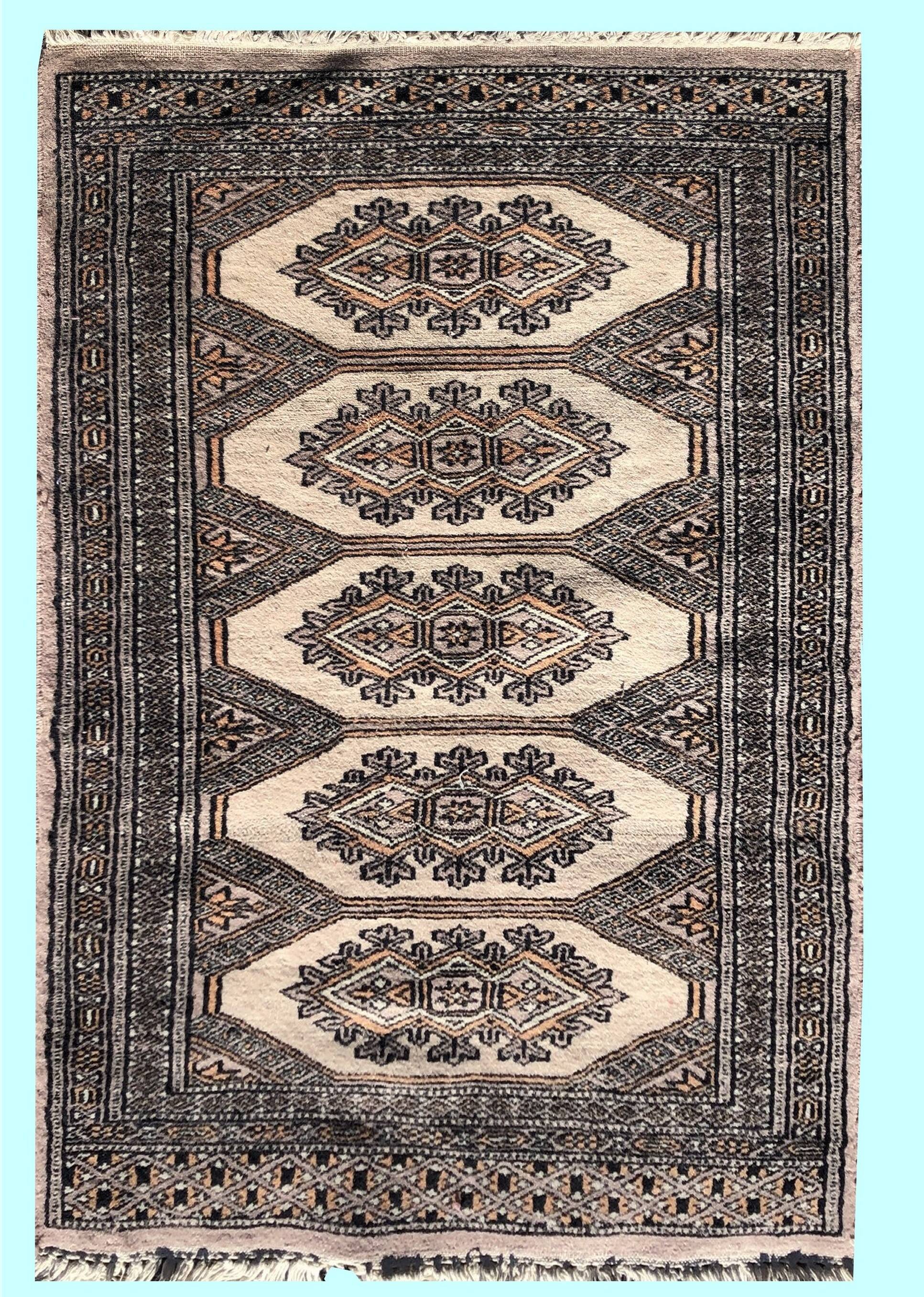 Pair of handmade Pakistani oriental rugs: 1.04 x 0.64 M