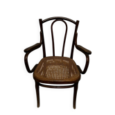 Thonet armchair stamped with curved wooden armrests and caning from the 19th century.