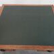 Antique writing table / partner desk with 4 drawers and a green leather top