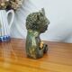 Clay sculpture of mother nature holding eggs, vintage modern figurative art