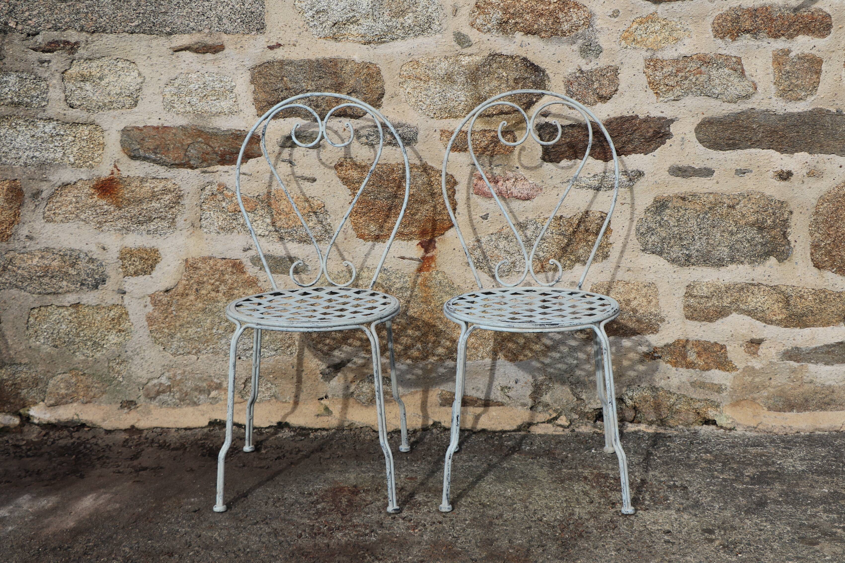 Series of 6 wrought iron garden chairs