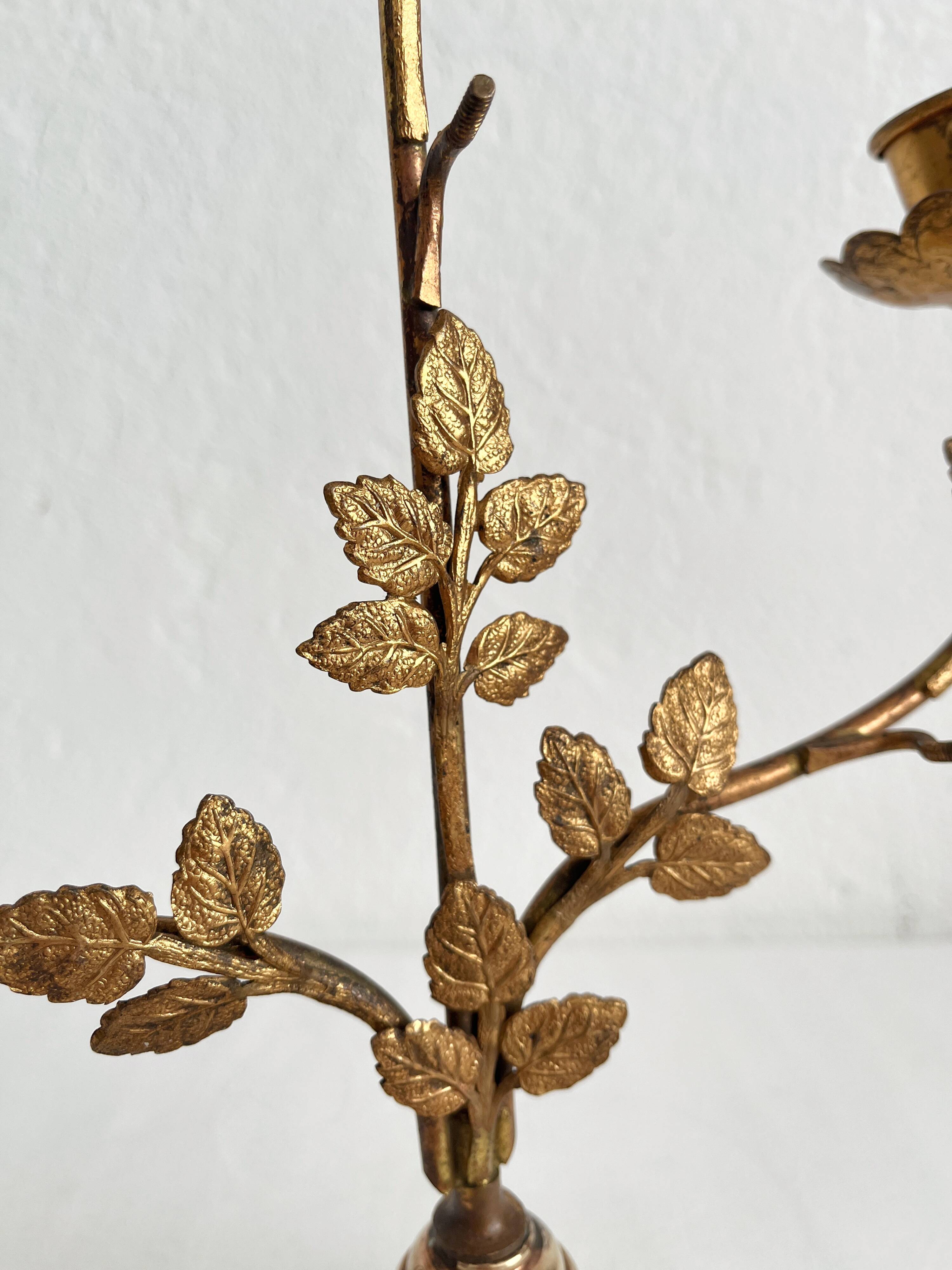 Antique bronze and brass candlestick with golden leaves