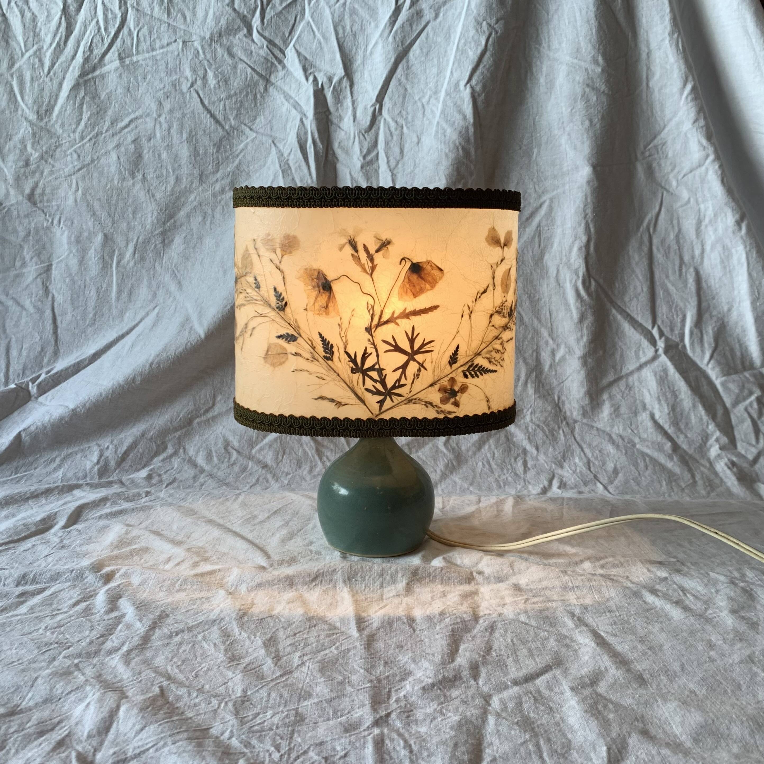 Old small green ceramic side lamp with dried flower lampshade
