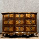 Louis XV period Arbalète chest of drawers in noble wood marquetry