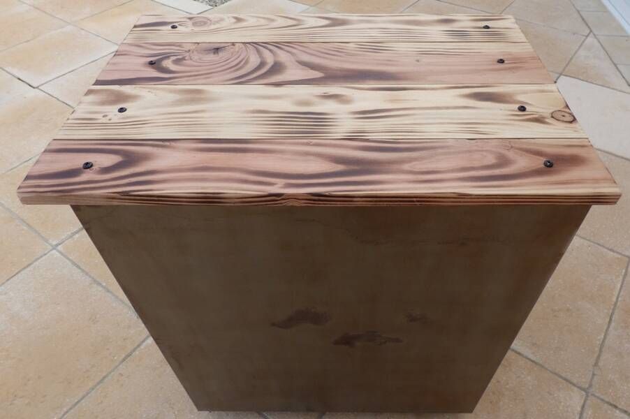 Vintage industrial metal furniture with a rusty effect, featuring two drawers on wheels.