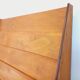 Vintage wooden display bookshelf with drawers from the 1960s.