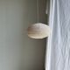 Average suspension in natural rattan and linen, Japanese-style, flattened oval in pink.