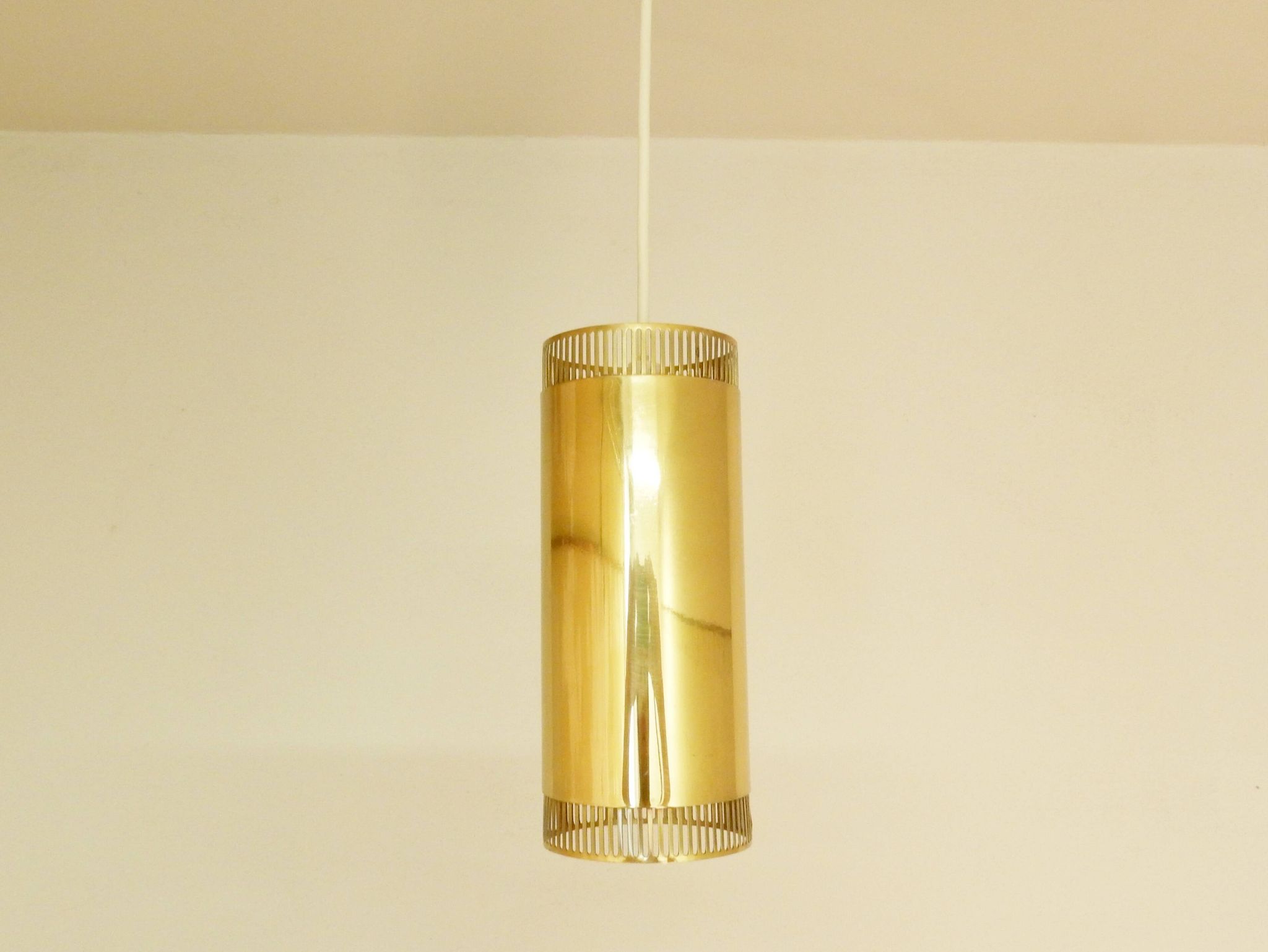 Set of 3 perforated brass cylindrical pendant lamps, Sweden 1960's