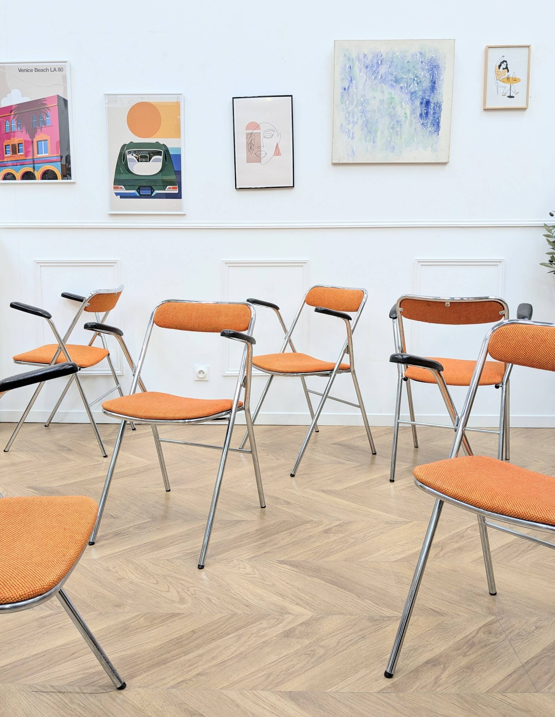 6 orange folding chairs