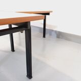 Suite of two vintage modernist Isa coffee tables in teak and black metal from the 60s
