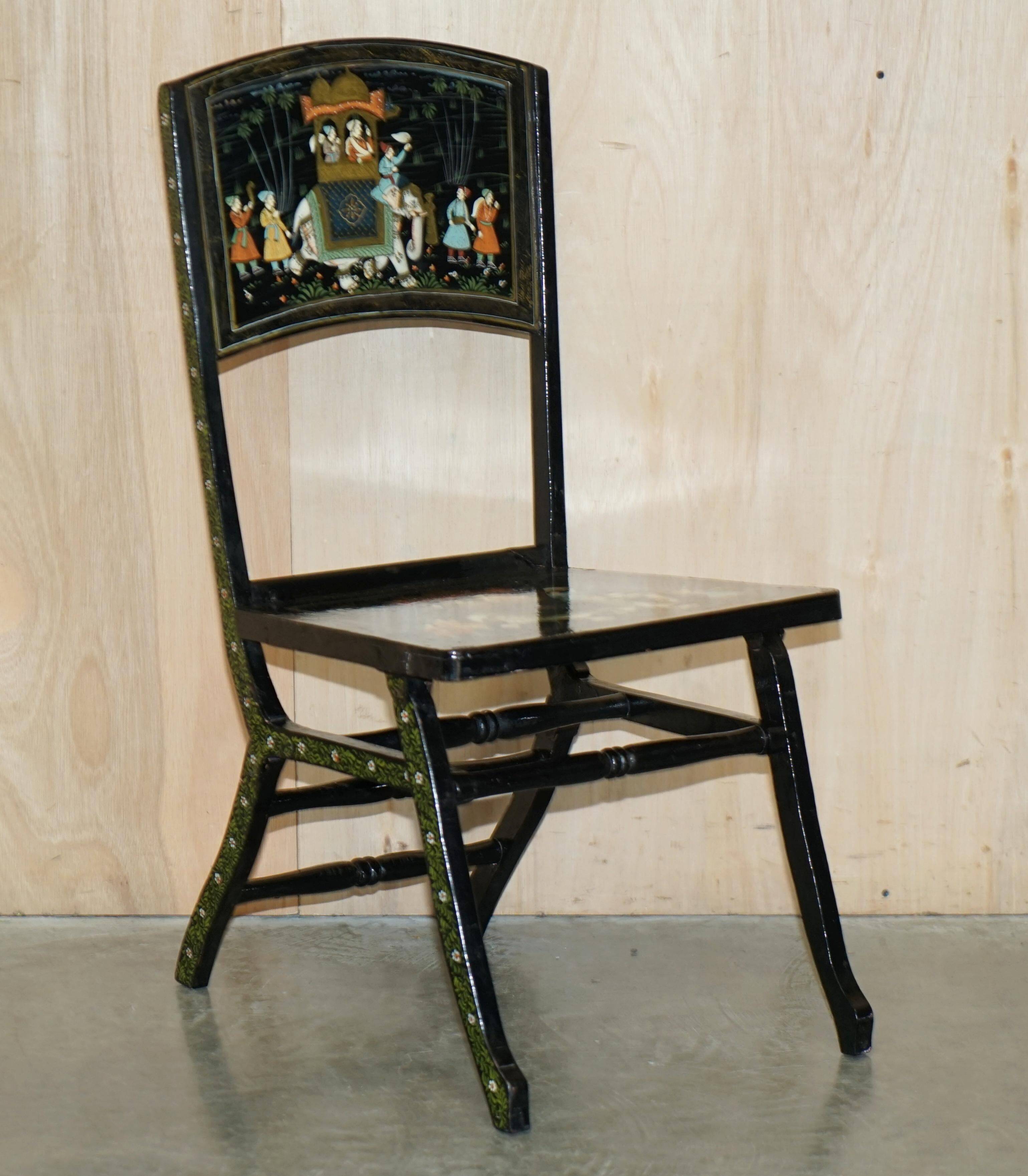 Pair of military folding chairs with Indian decoration.