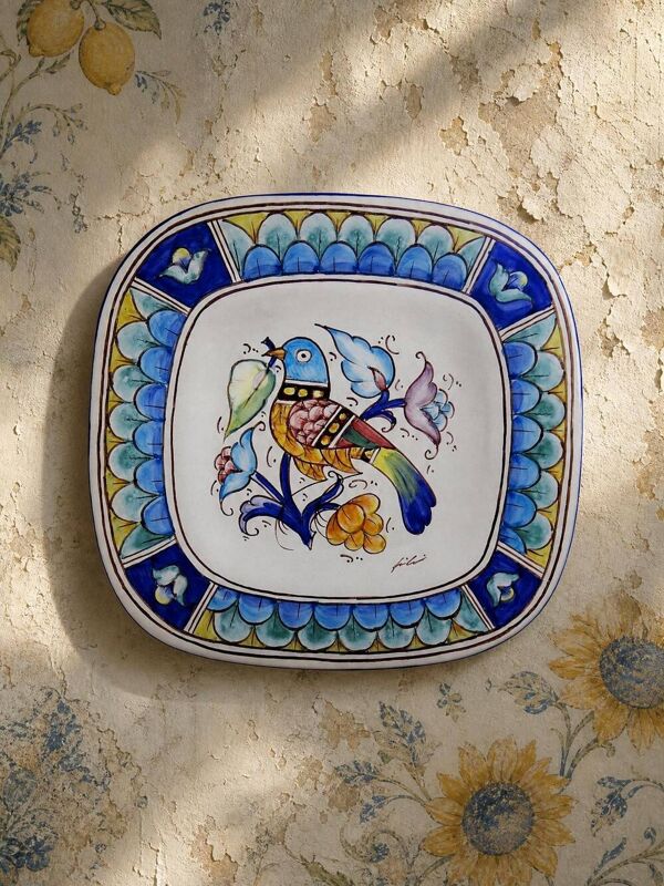 Plat mural italien vintage Gubbio en faïence peinte à décor d'oiseau