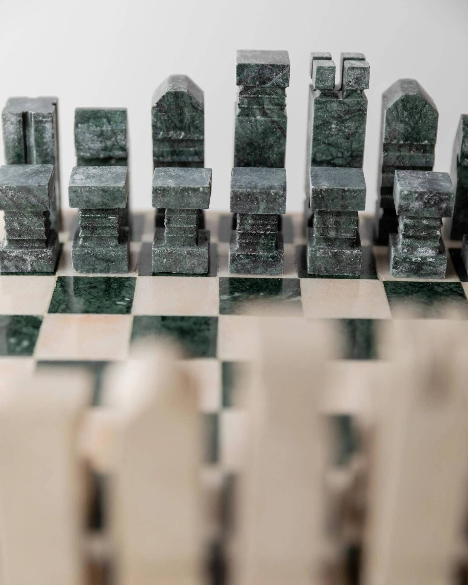 Vintage marble chess set from the 1970s, green and beige stone board, heavy design, geometric pieces, sculptural tabletop game, gift idea.
