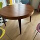 Butterfly table in teak with 2 extensions.