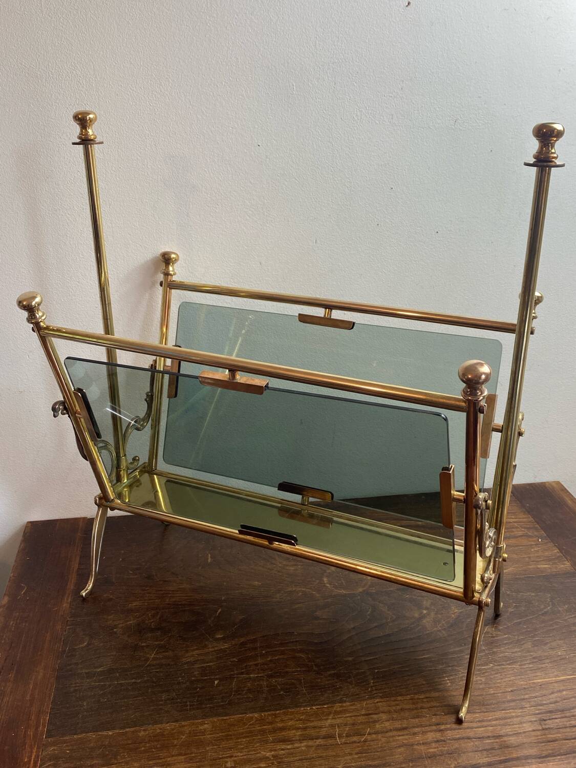 Brass magazine rack and blue-tinted glasses, 1950s.