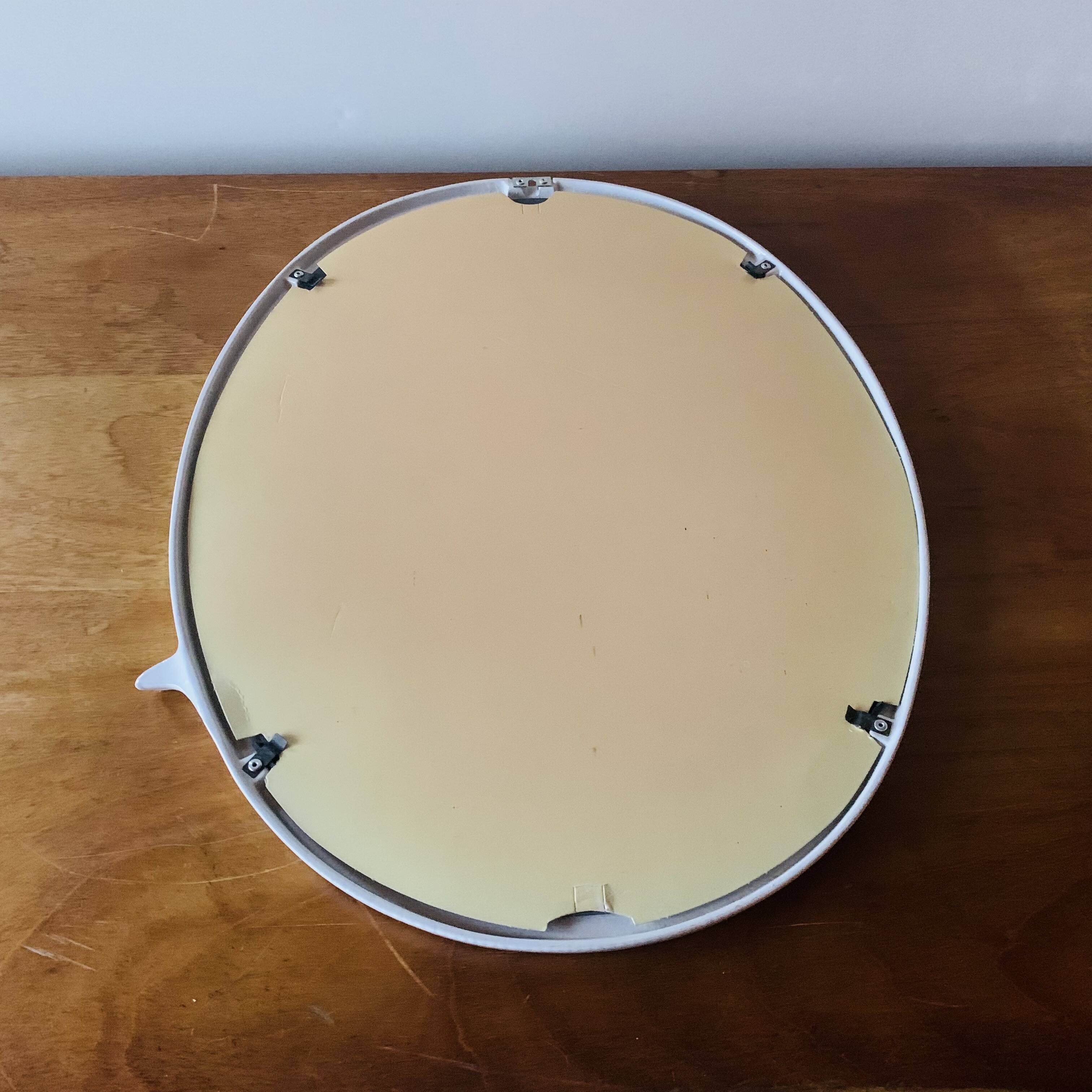 Oval mirror in vintage enameled white cast iron