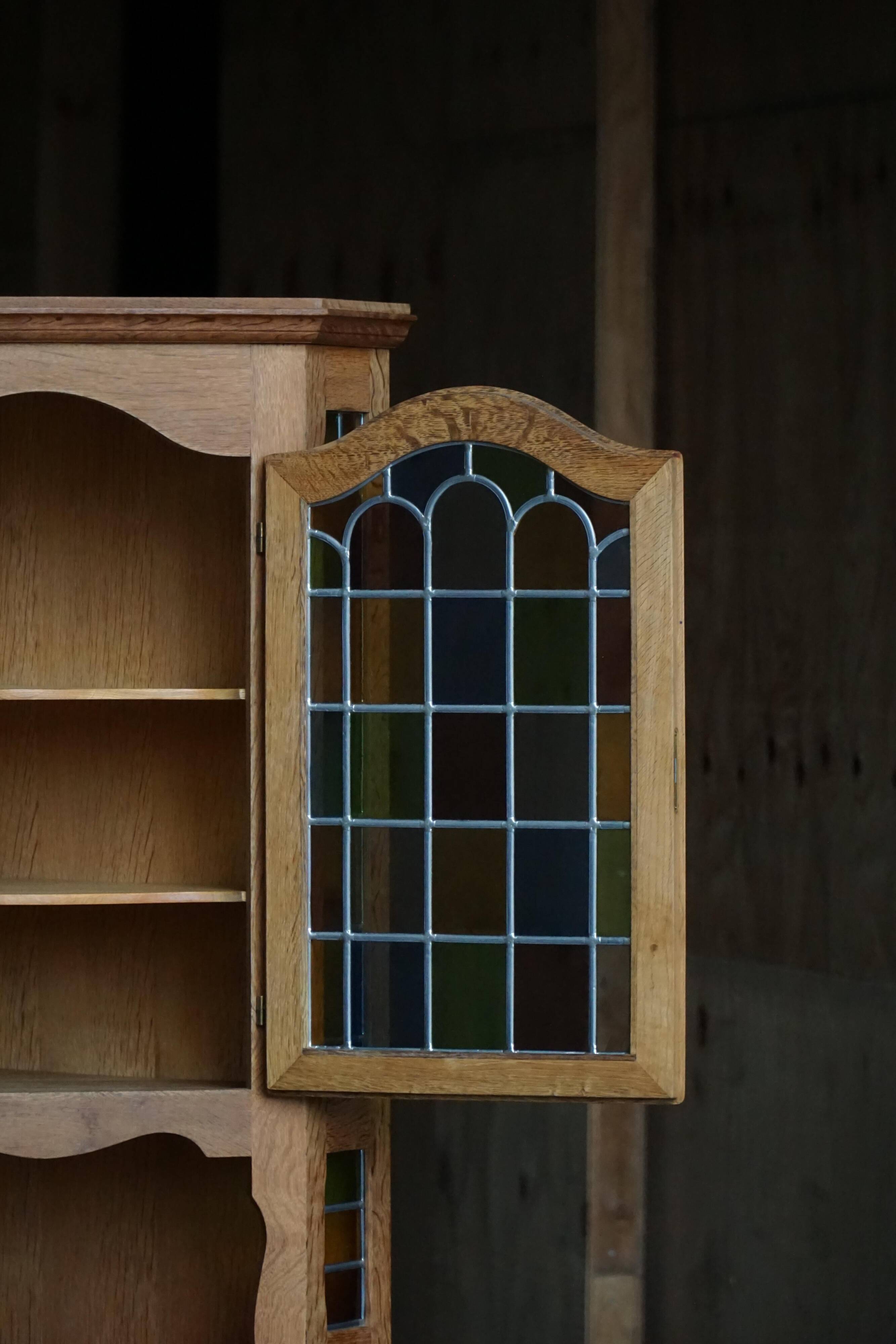 Mid-century Danish corner cabinet in oak with leaded glass, 1940s.