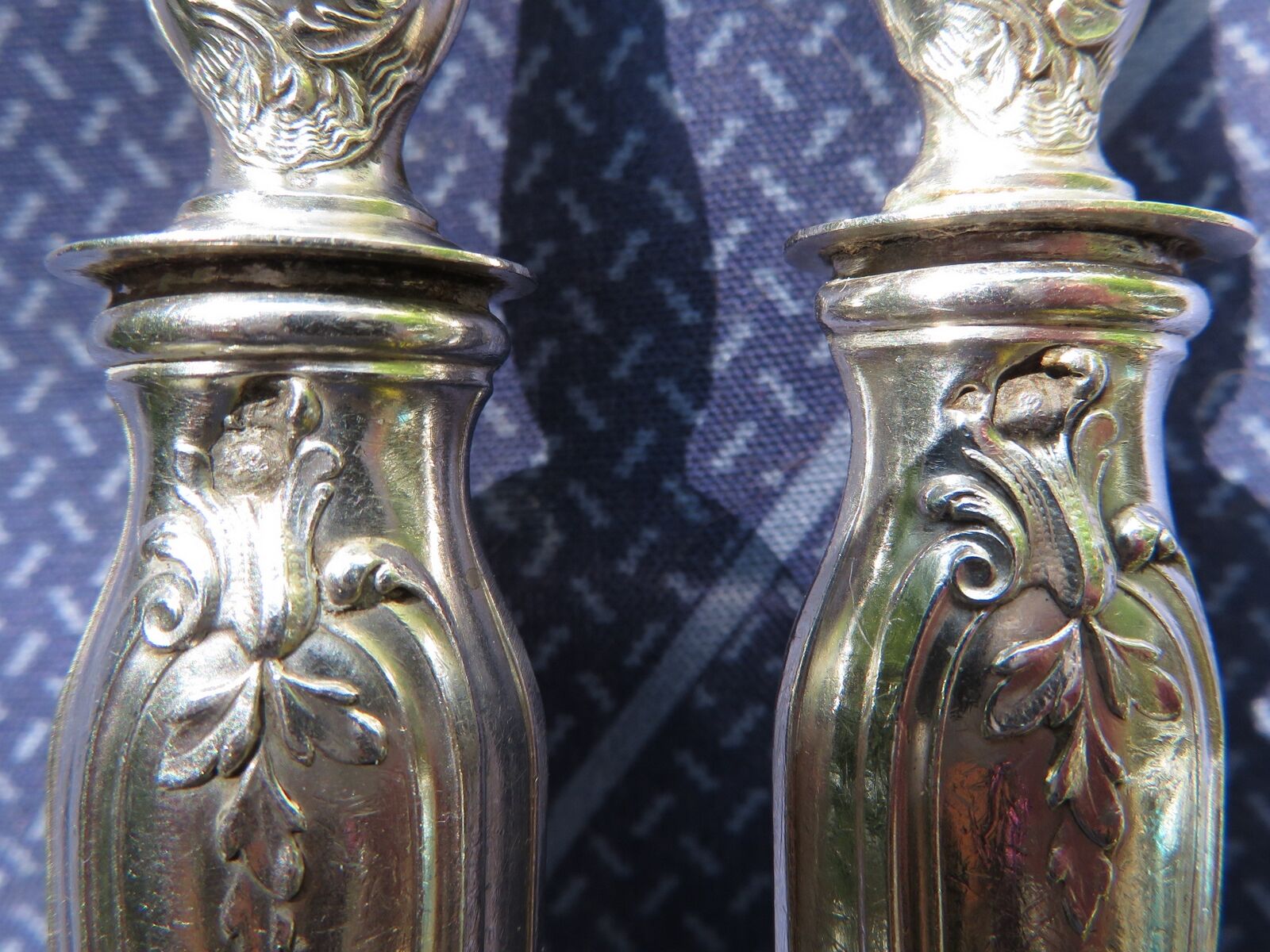 Silver salad servers stuffed in its case