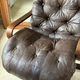 1970s Scandinavian armchair in curved laminated wood with a leather seat.