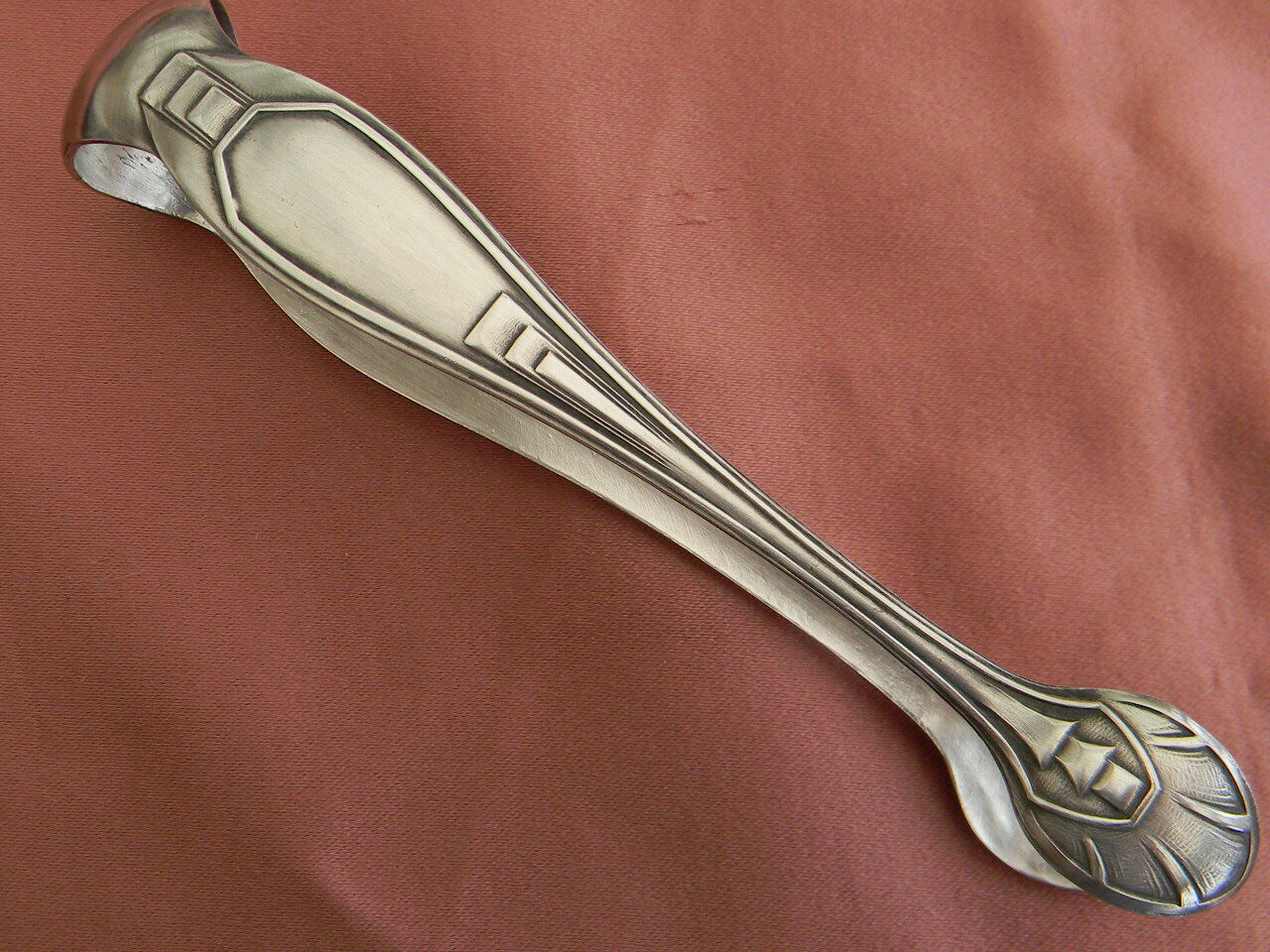 Art deco sugar tongs in silver metal