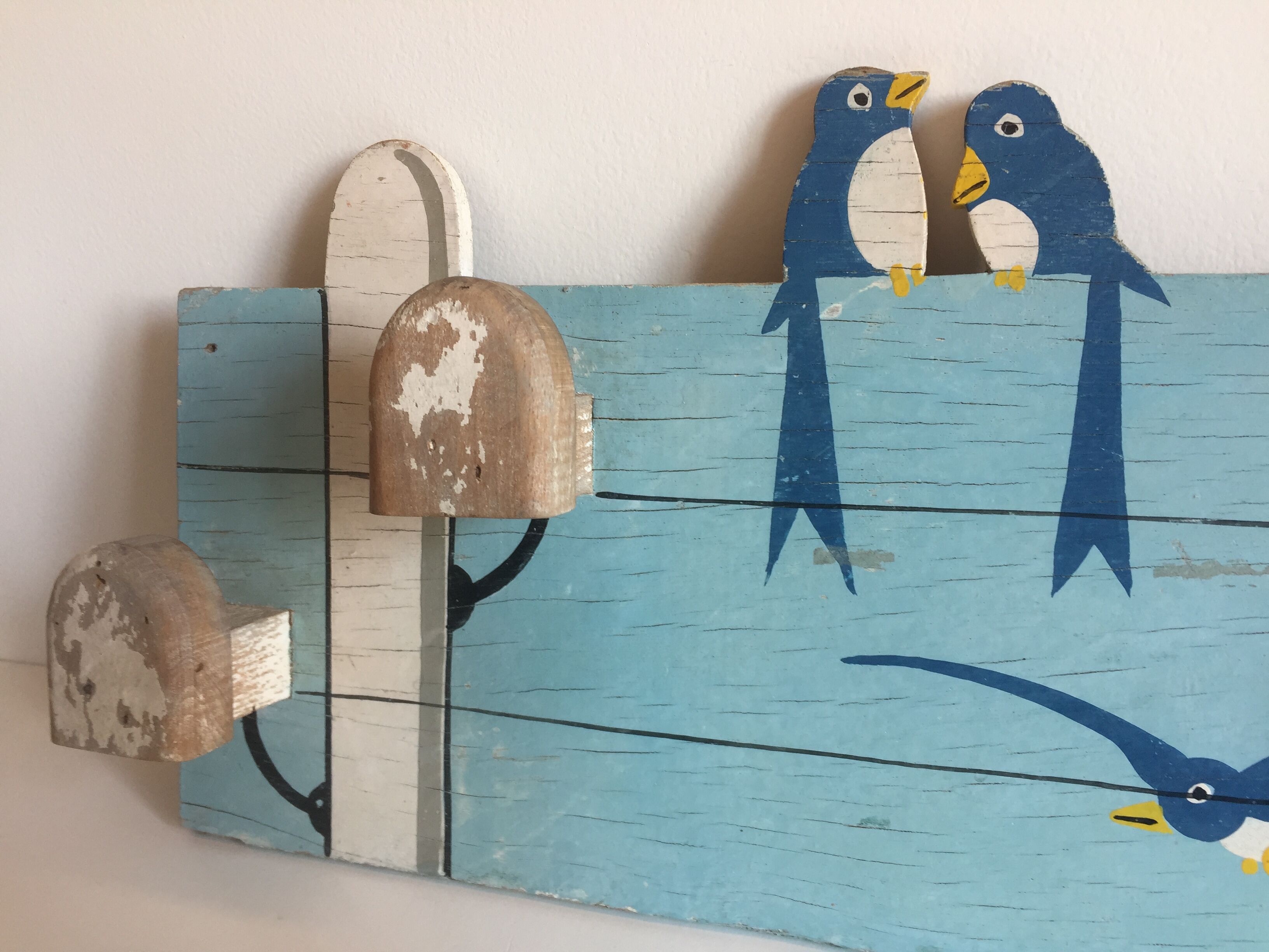 Coat rack with vintage swallows