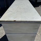 Old chest of drawers in bleached wood with white marble top