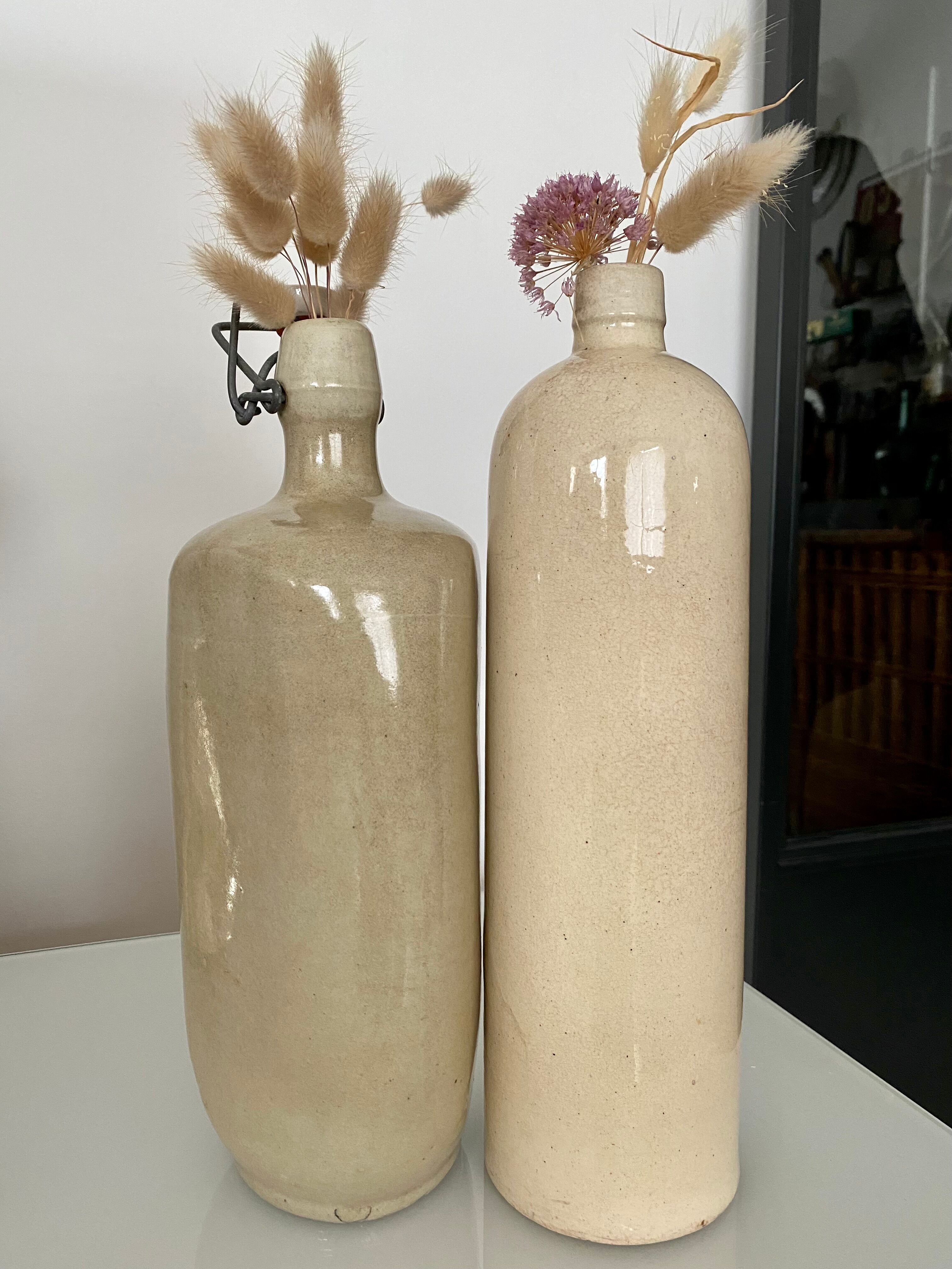 Set of 2 enamelled sandstone bottles