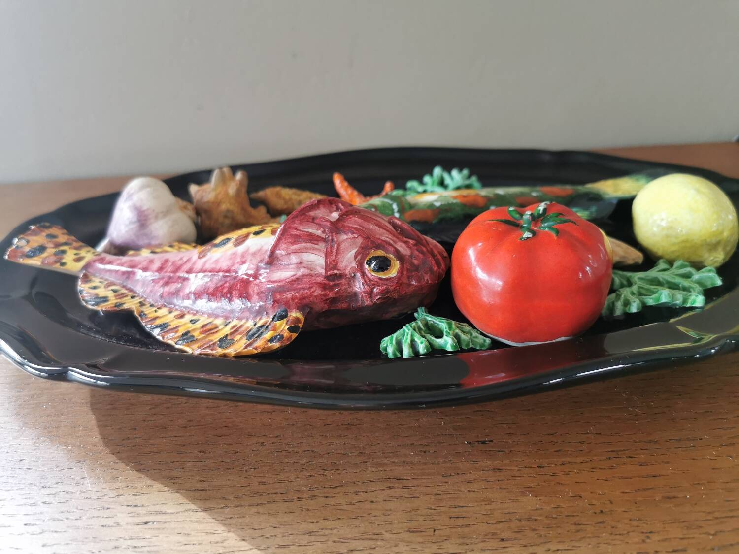 Vintage barbotine dish with fish decoration in relief