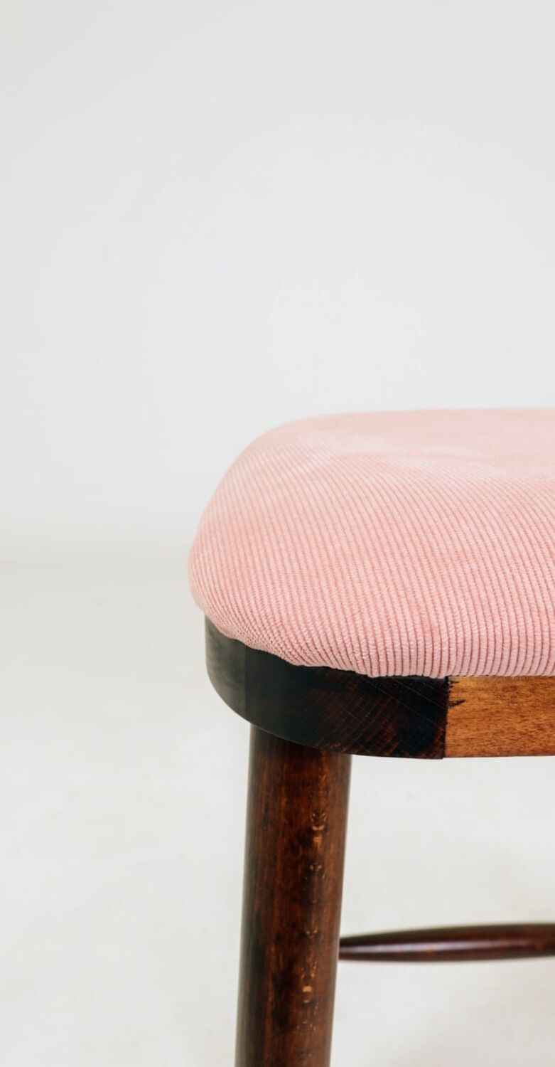 Bar stools matching the vintage style, in pink corduroy.