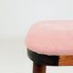 Bar stools matching the vintage style, in pink corduroy.
