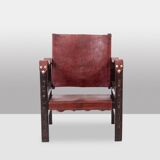 “Safari” armchair in wood and cognac leather. 1960s/70s.