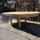 Round solid oak table with extensions, maximum 220cm.