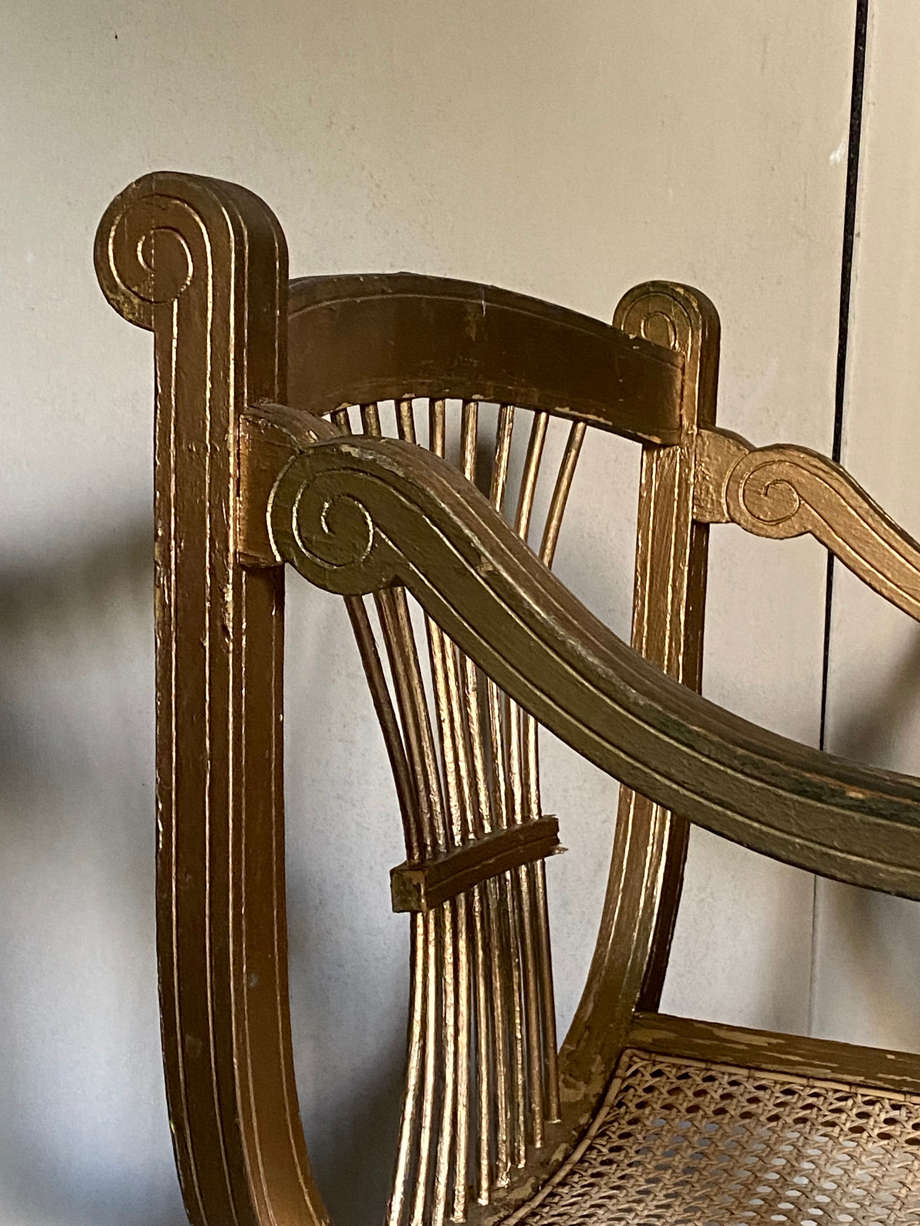 Pair of canework golden armchairs