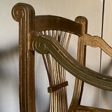 Paire de fauteuils dorés cannés