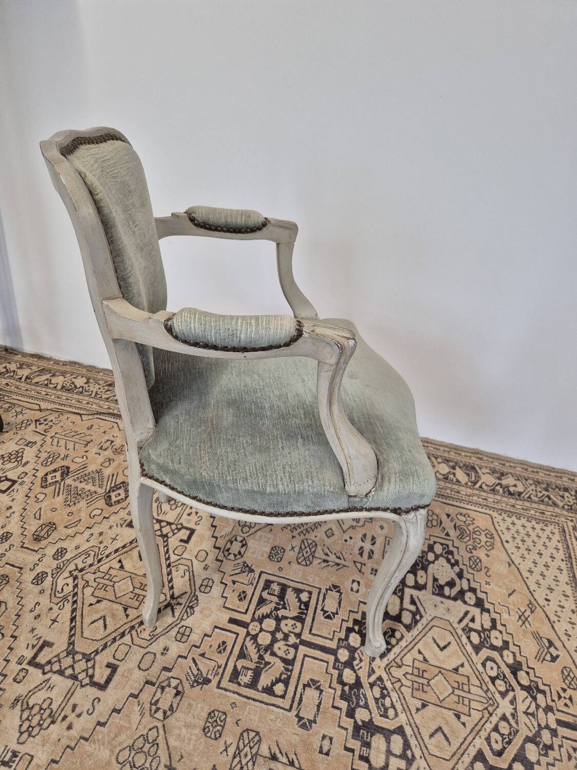 Louis XV style cabriolet armchair in patinated wood and velvet