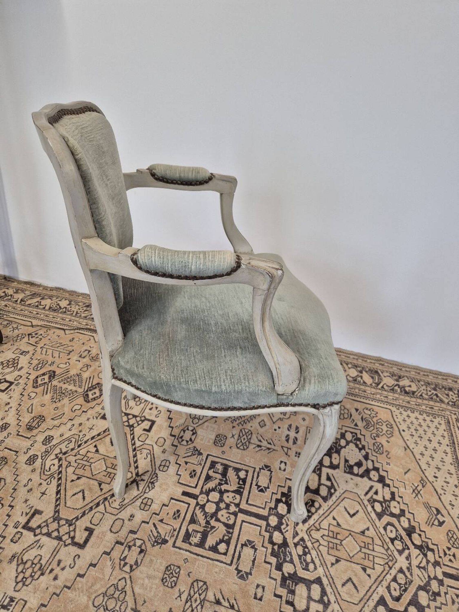 Louis XV style cabriolet armchair in patinated wood and velvet